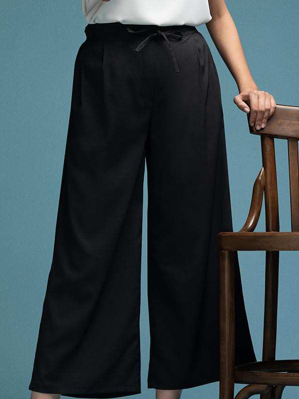 شلوار زنانه پارچه ای کرپ کره ای از بالا گشاد پیلی دار پشت کمرکش کژوال آرانا برنس Bornos