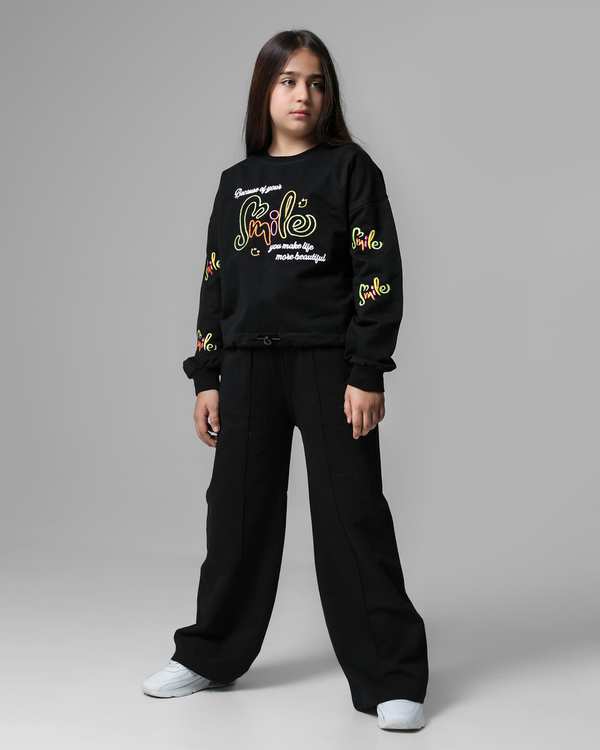 ست سویشرت و شلوار دخترانه مشکی لئو کیدز Leo Kids طرح گلدوزی اسمایل کد 6831