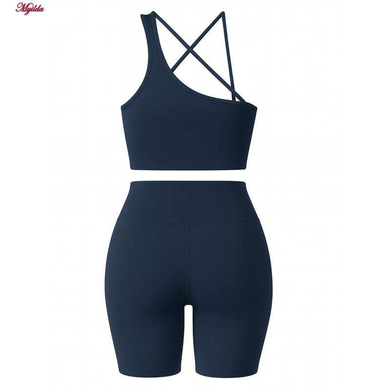 ست نیم تنه و شلوارک ورزشی زنانه رنگ سرمه ای ماییلدا مدل 5409-7106