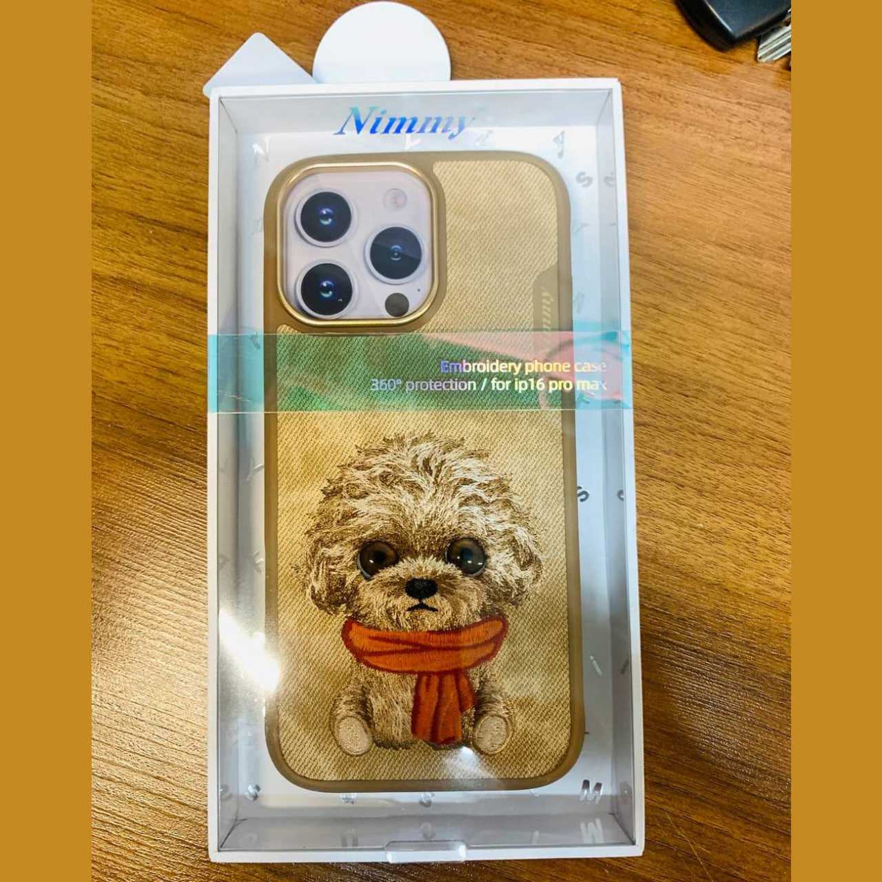 قاب مگسیف گوشی آیفون 16 پرو طرح سگ گلدوزی شده نیمی N-XDY-IP16-PRO-014